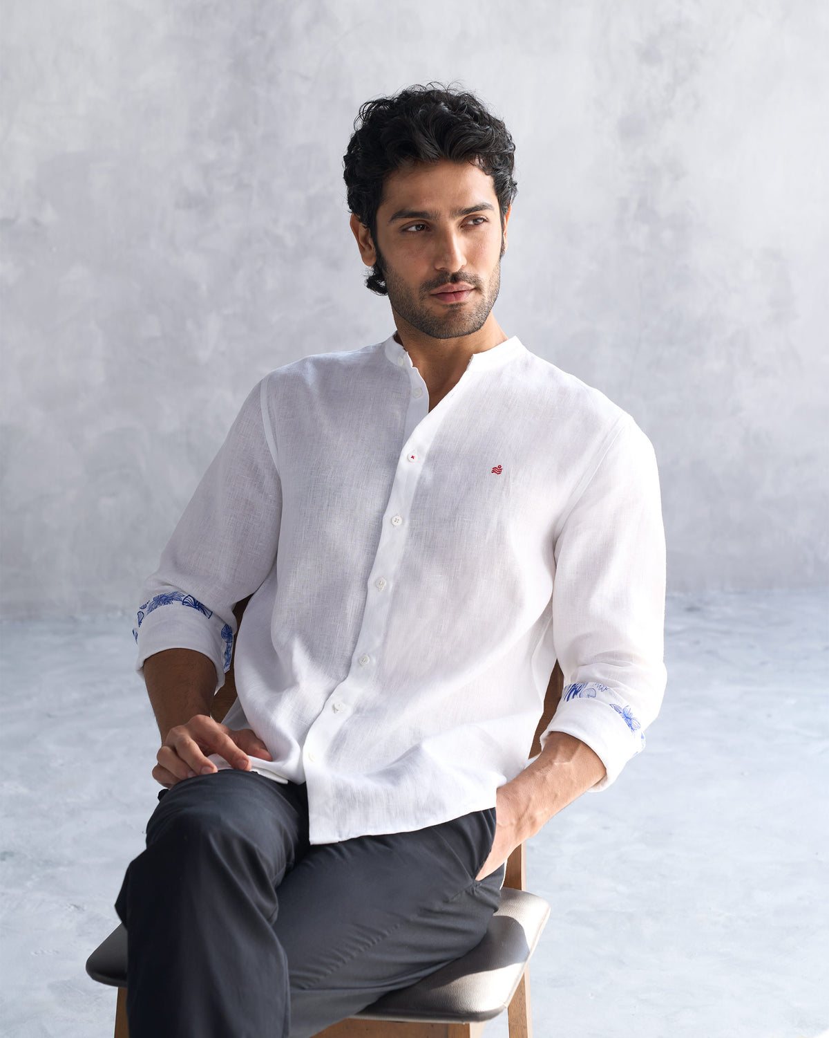 White Nawab shirt with rolled printed cuffs worn at a three-quarter angle.