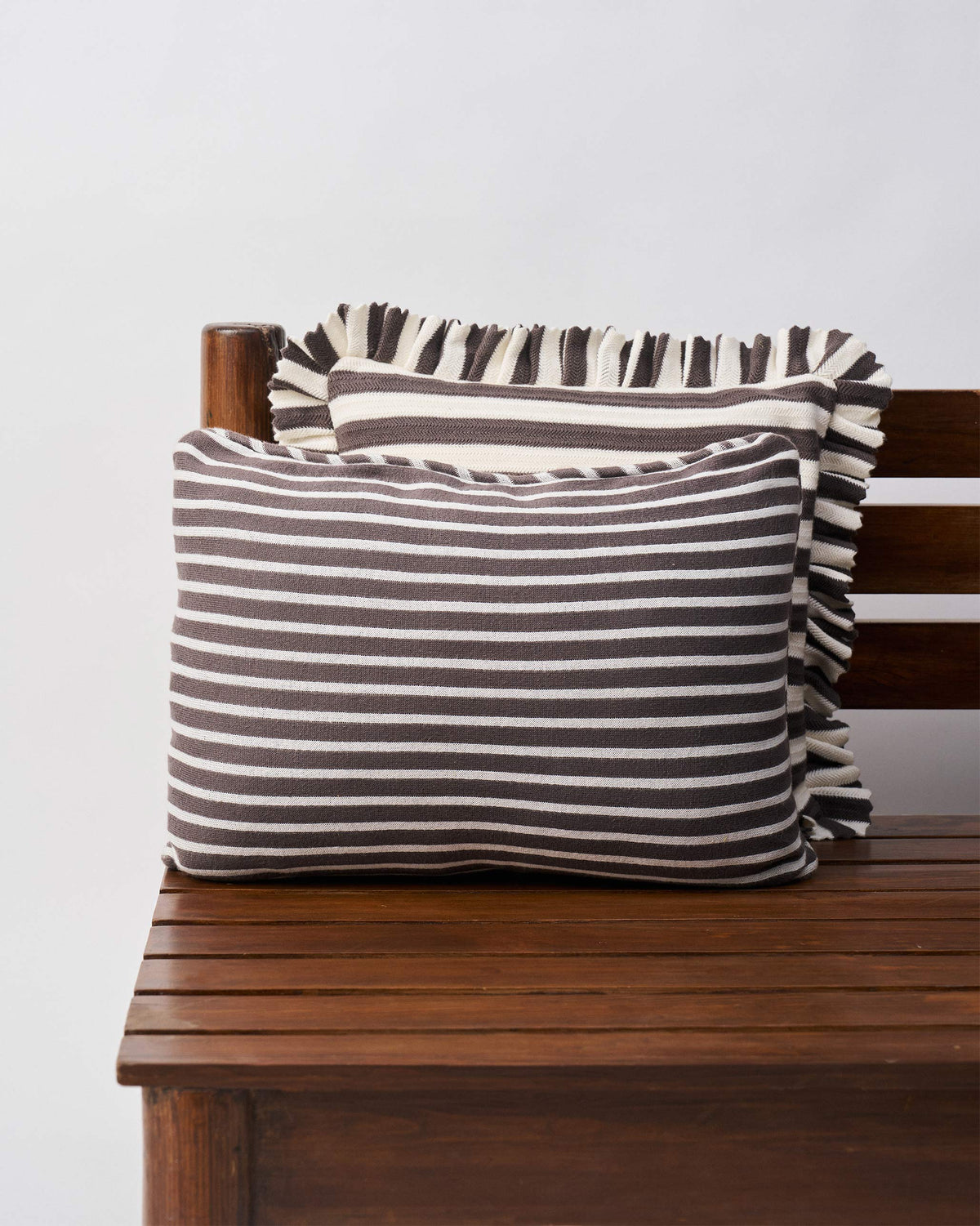 Back of the Quilted Palm cushion cover in charcoal and white stripes.