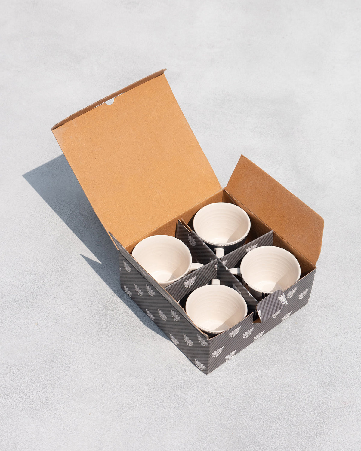 Serenity espresso mug set of four packed in an open gift box.