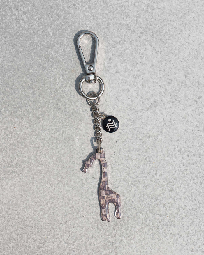 Giraffe Keychain with a patterned giraffe charm on a silver clasp.