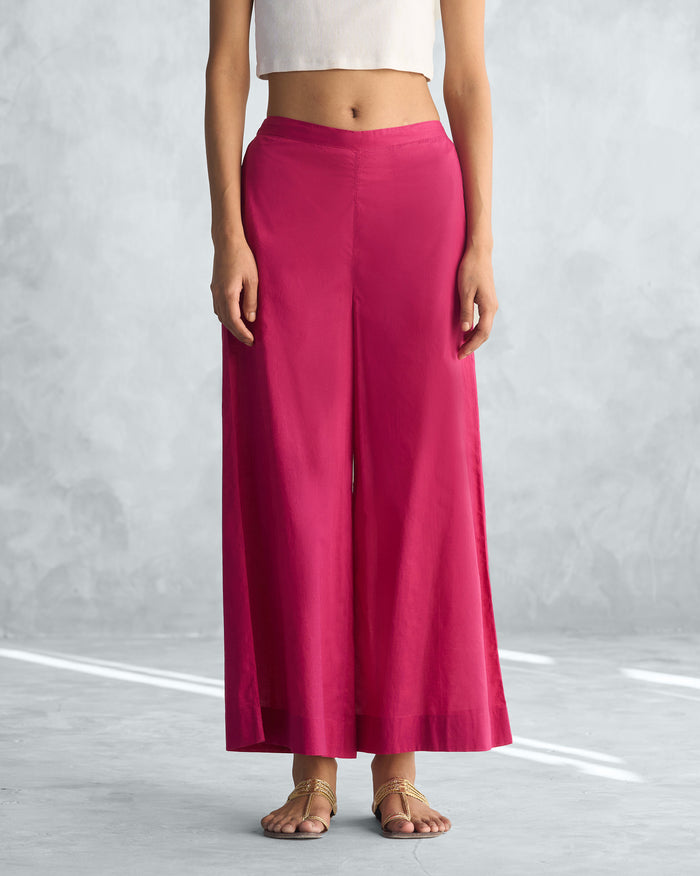 Person wearing Basic Pyjamas in berry with a wide leg.