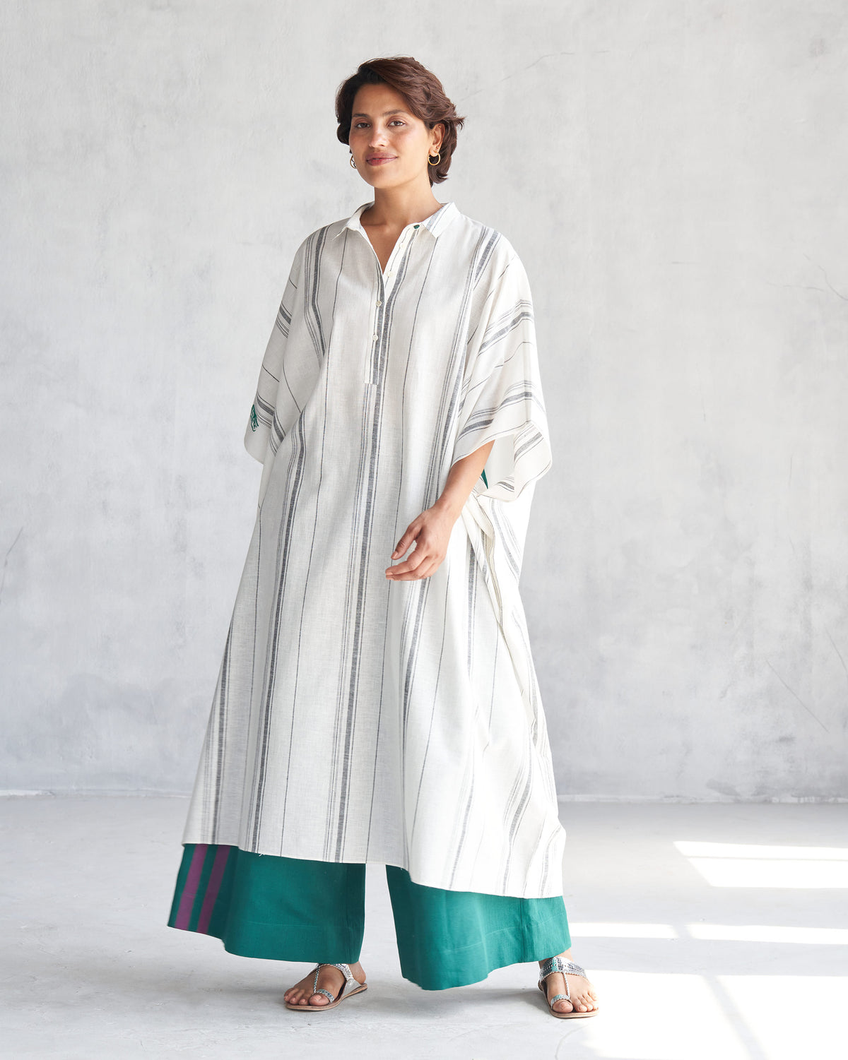 Ivory collared kaftan with grey stripes and a half button placket.