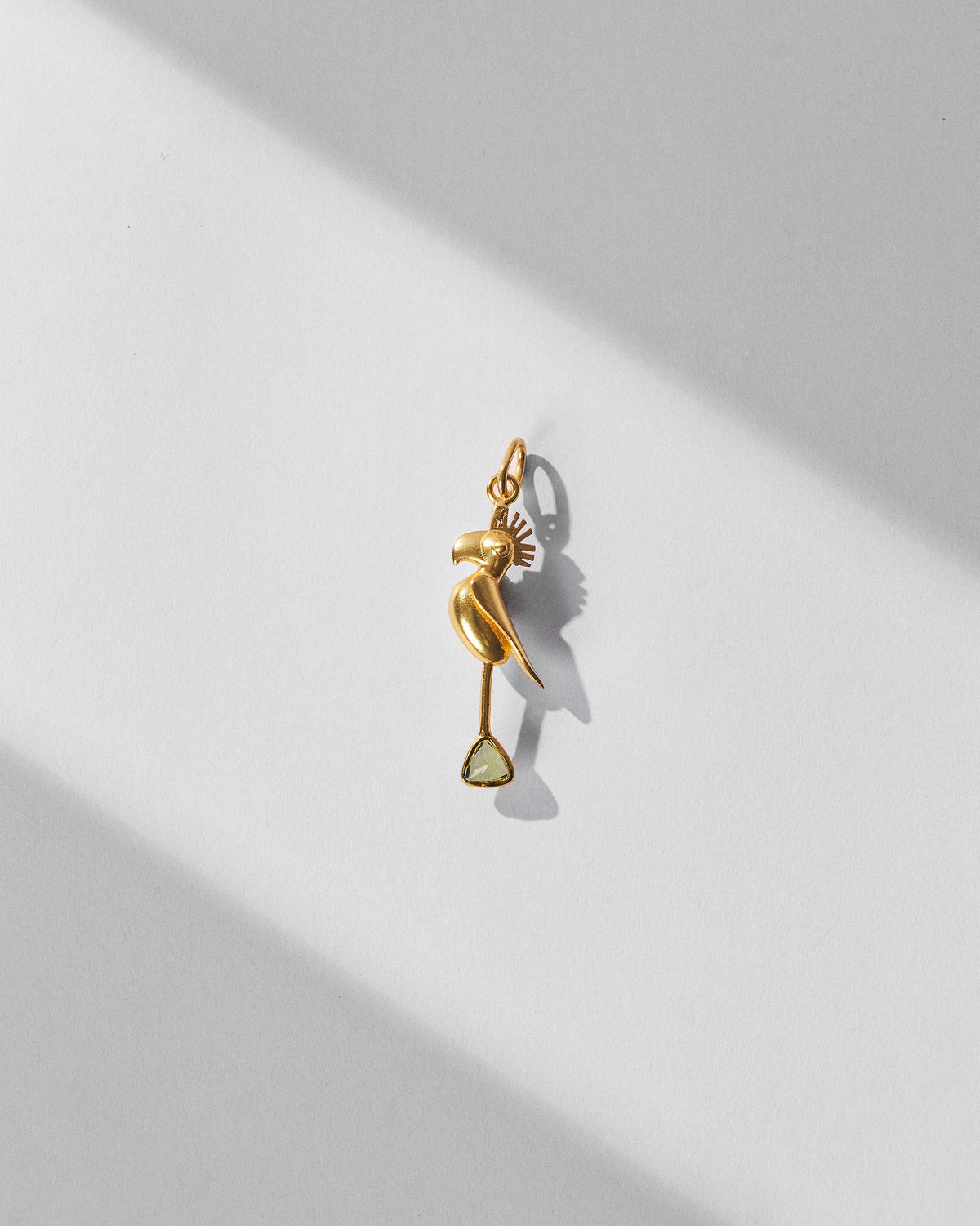 Gold Parrot Charm shown alone on a light background.