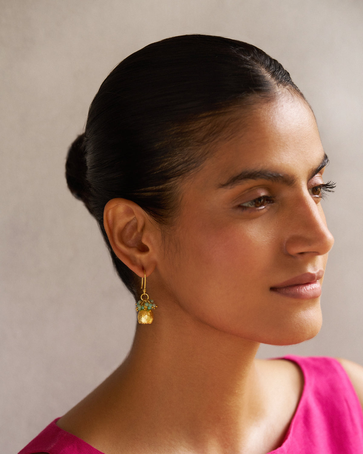 Side view of a person wearing a Himalayan Poppy Drops earring.