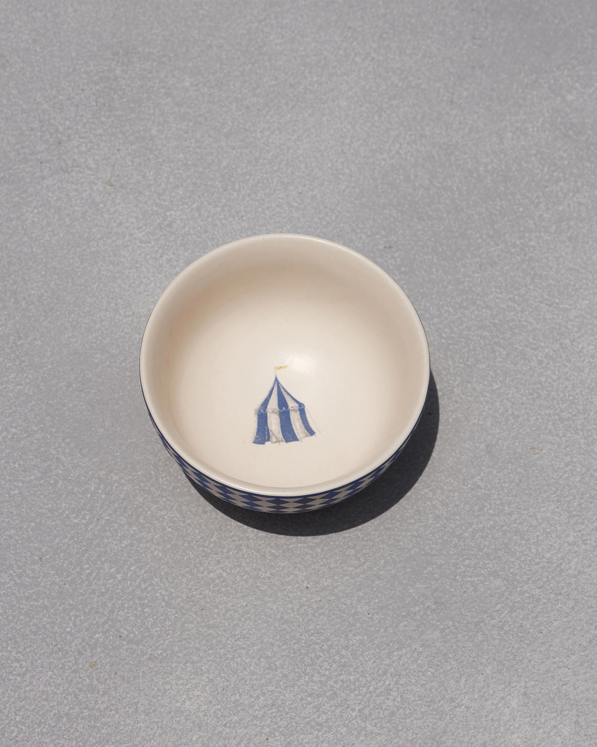 Sahara katori with a blue tent painted inside.