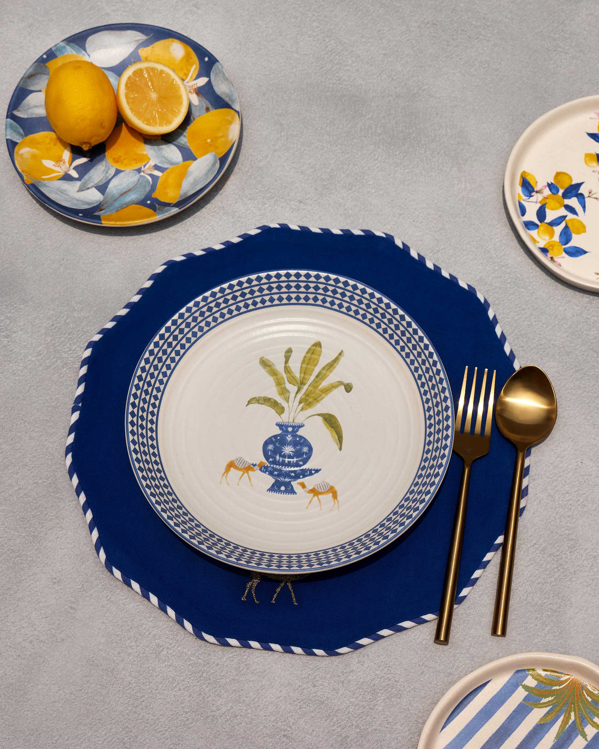 Sahara pasta plate set with gold cutlery.