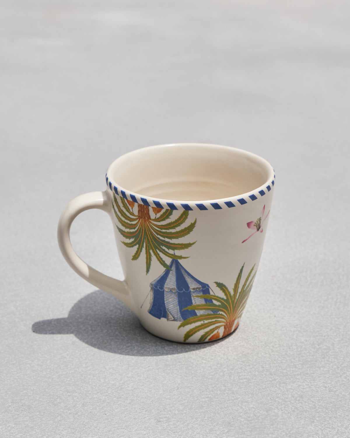 Side view of the Sahara conical mug with its handle on the left.
