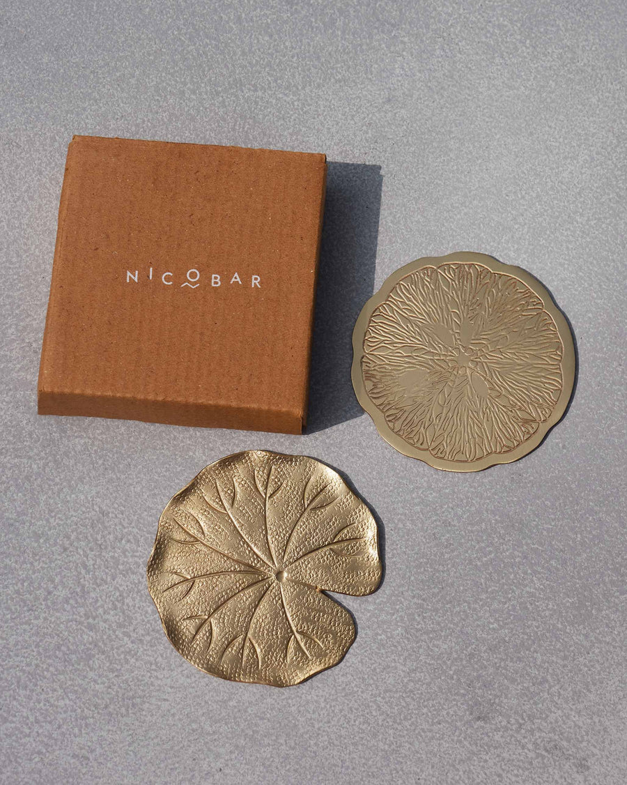 The coasters beside a kraft Nicobar gift box