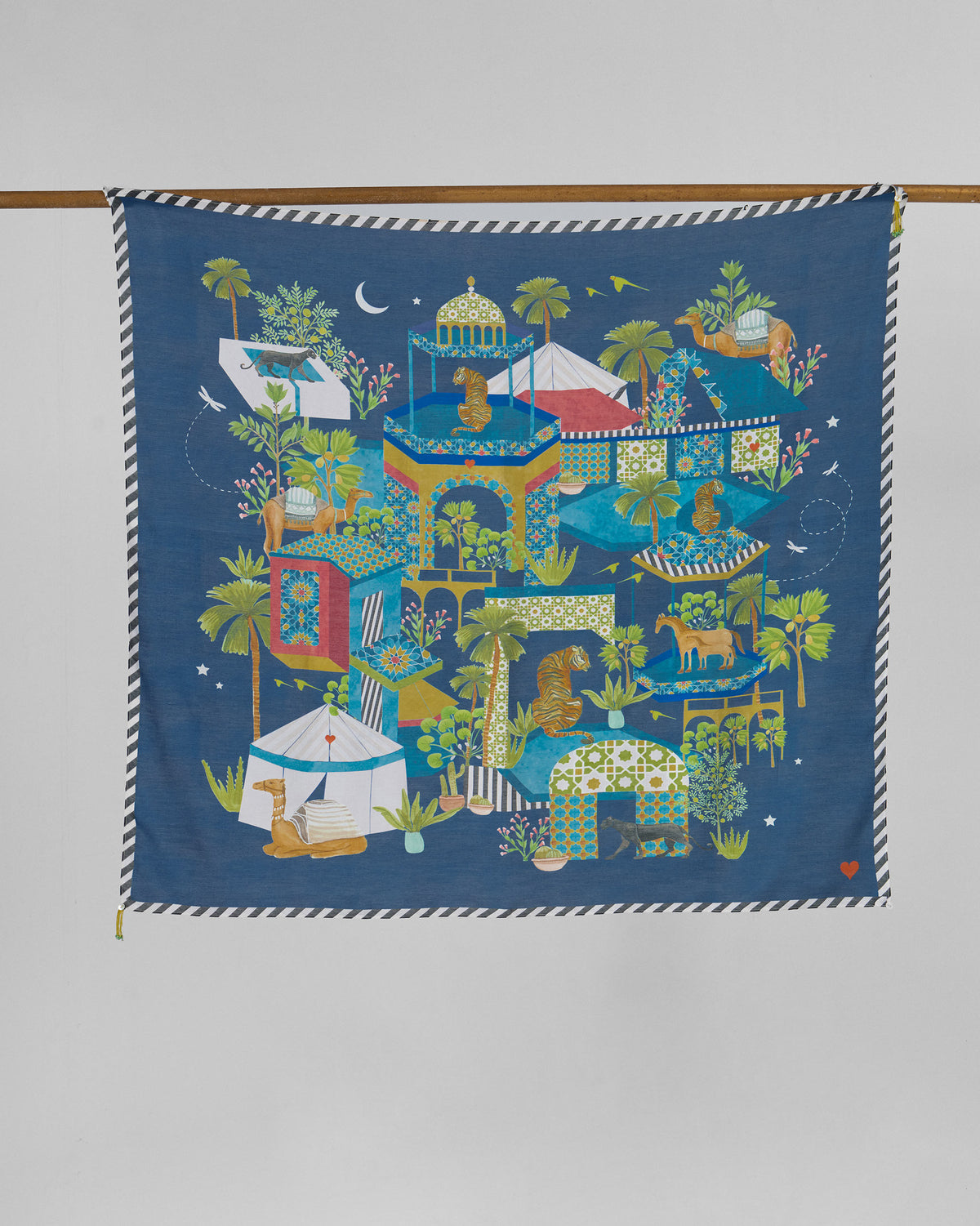 Midnight Carnival scarf hung flat, showing tents, palm trees and animals on navy.