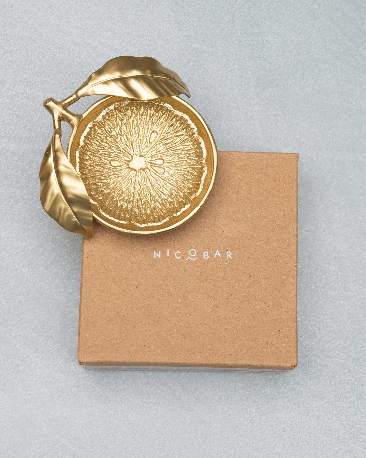 Gold Lemon Trinket Tray on a kraft Nicobar box.