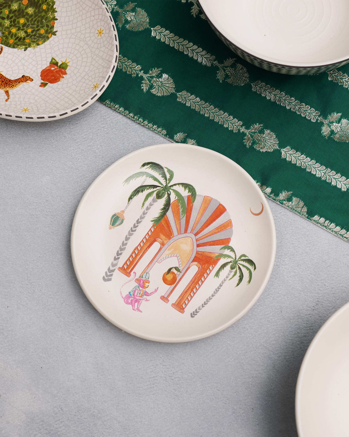 Mirage quarter plate styled among other printed tableware.