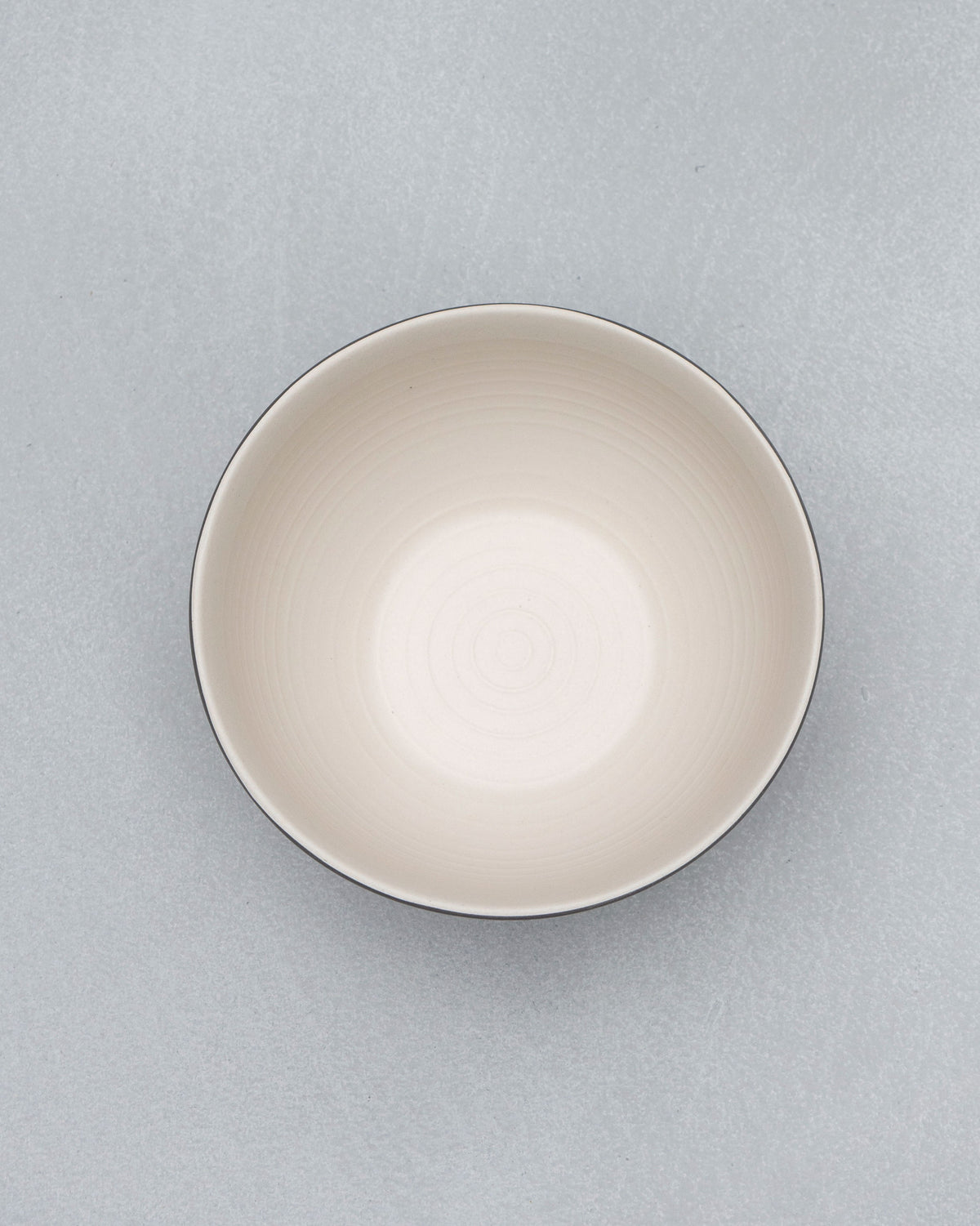 Overhead view of Zellij Serving Bowl showing its cream interior and dark rim.