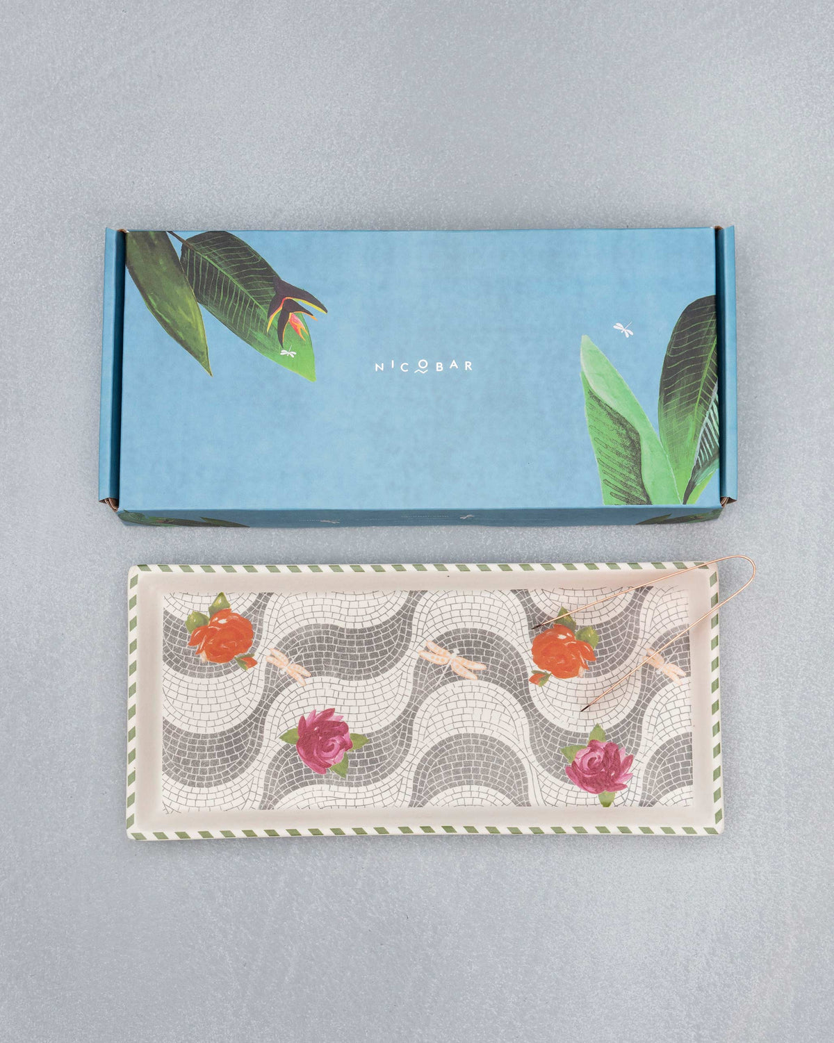 Mosaic Bloom cookie tray with floral mosaic print beside its blue Nicobar gift box.