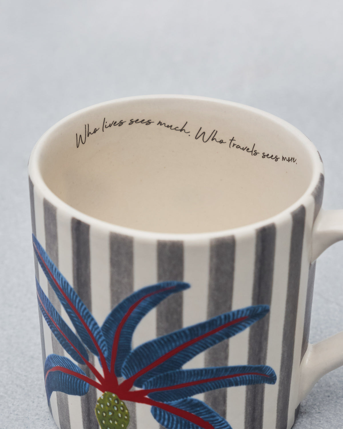 Overhead of a Dancing Palm Straight Mug showing the inner quote and palm motif.