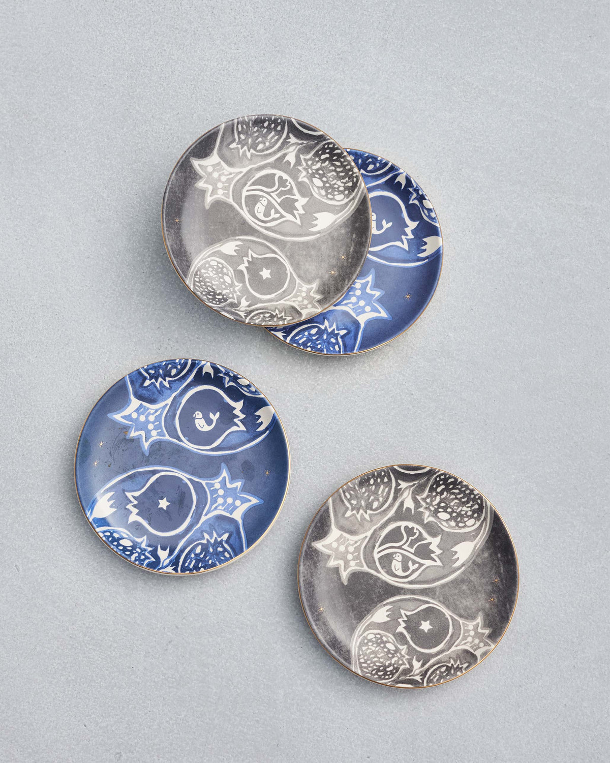 Four small Teatime Set dishes in blue and grey with a patterned motif.