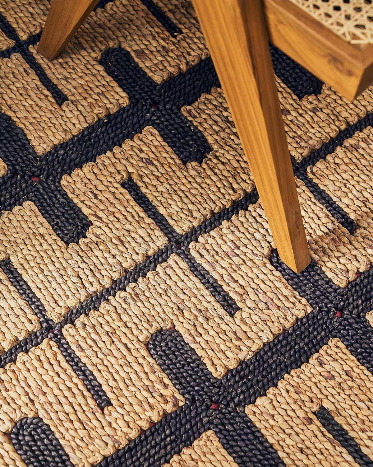 Angled close-up of the Marrakesh floor rug showing its woven pattern.