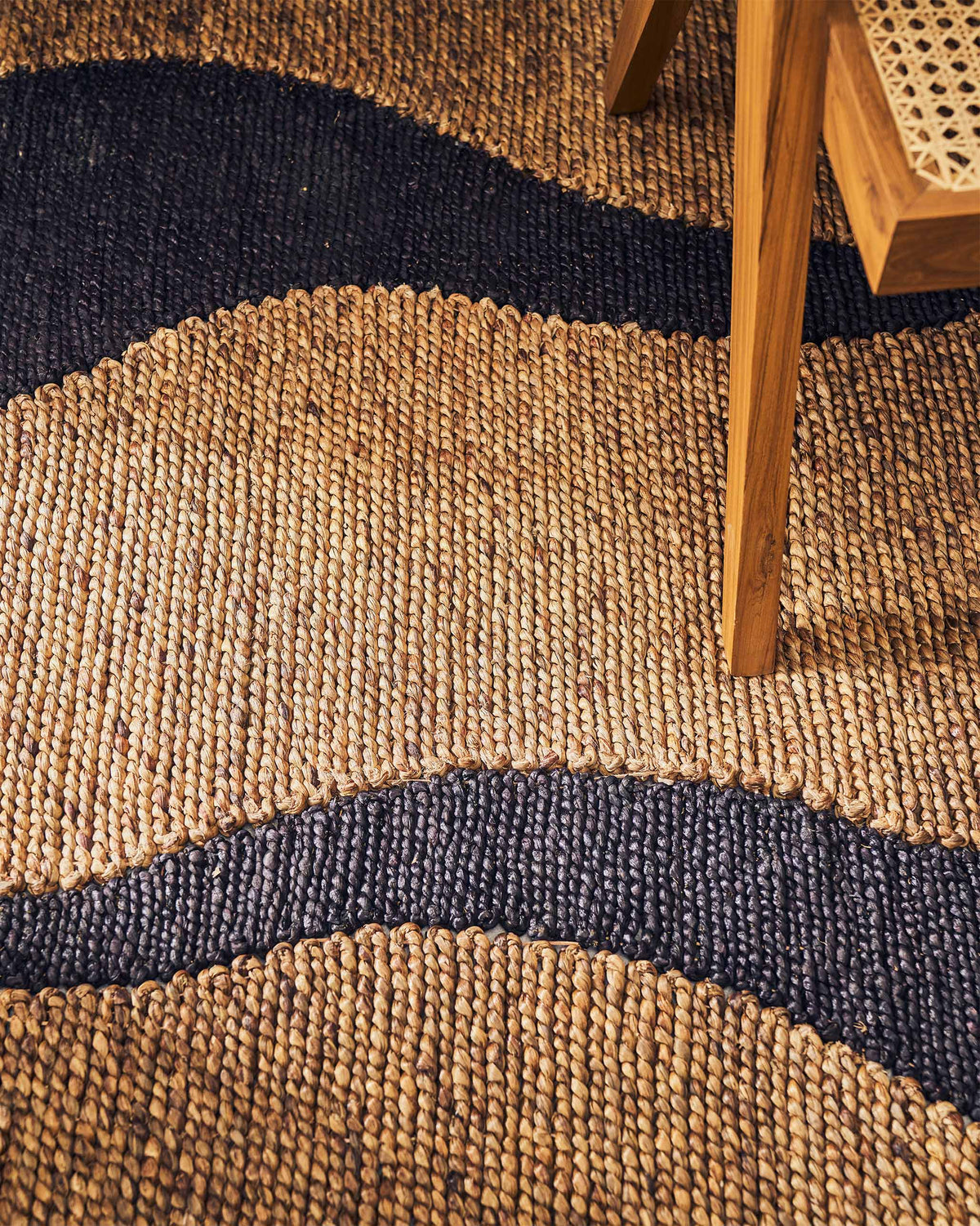 Close-up of the Rabat Floor Rug showing its woven texture and dark wave band.