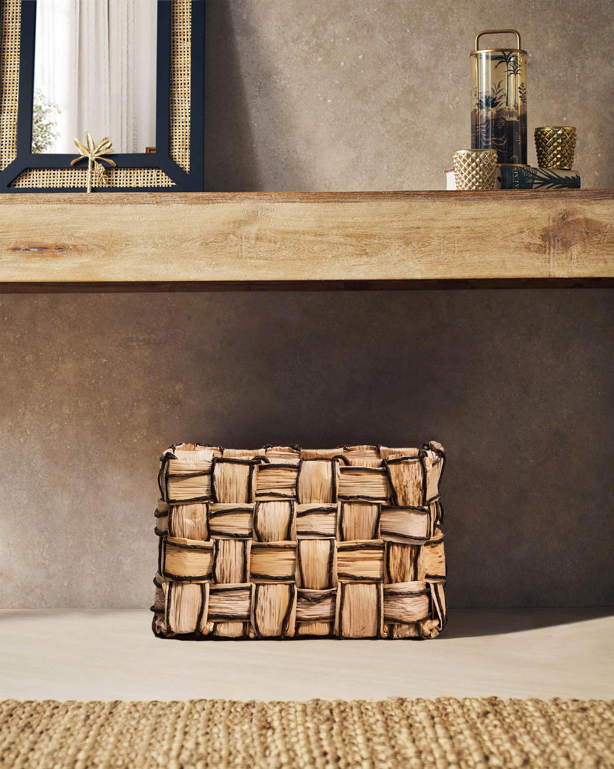 Small Mosaic basket stored under a wooden console.