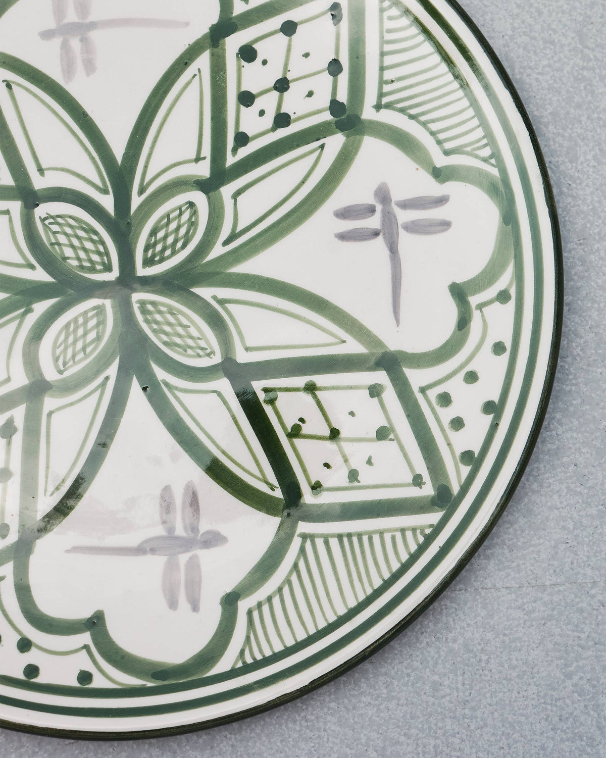Close-up of the Mosaic Oasis Quarter Plate showing its green flower motif and dot border.