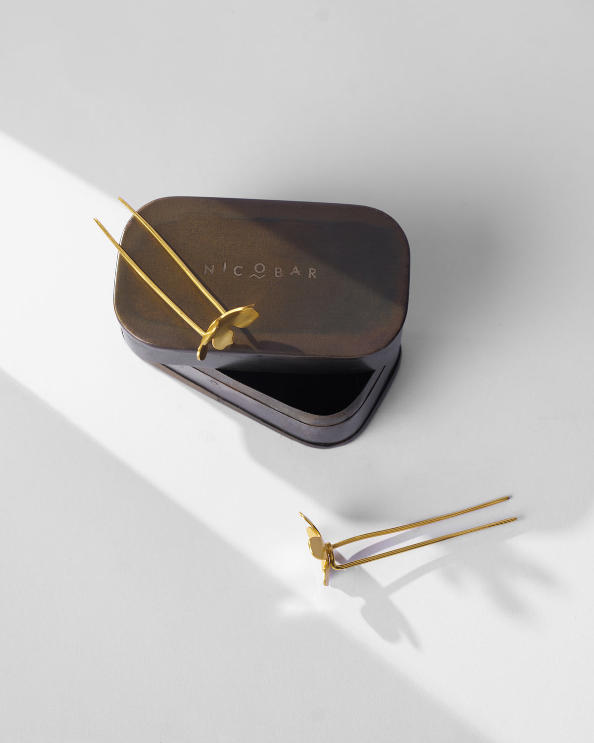 Gold Small Poppy hairpins with a Nicobar gift tin.