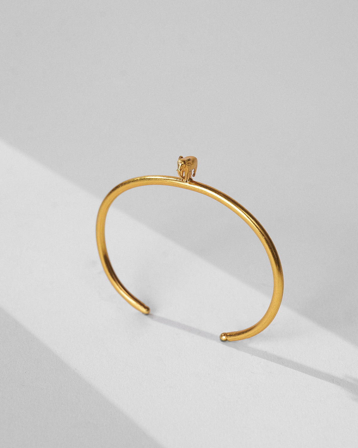 Gold haathi cuff showing the sculpted elephant on the band.