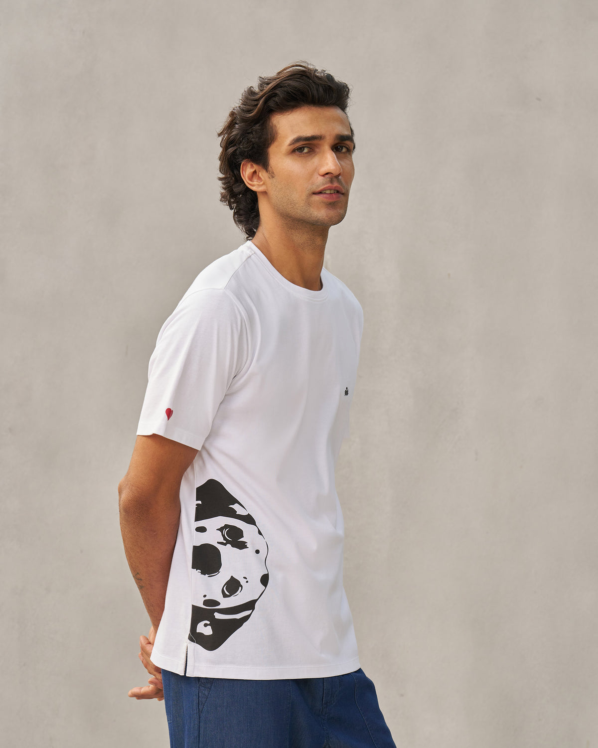 Side view of a white Peekaboo Dalmation T-shirt showing the large side graphic.