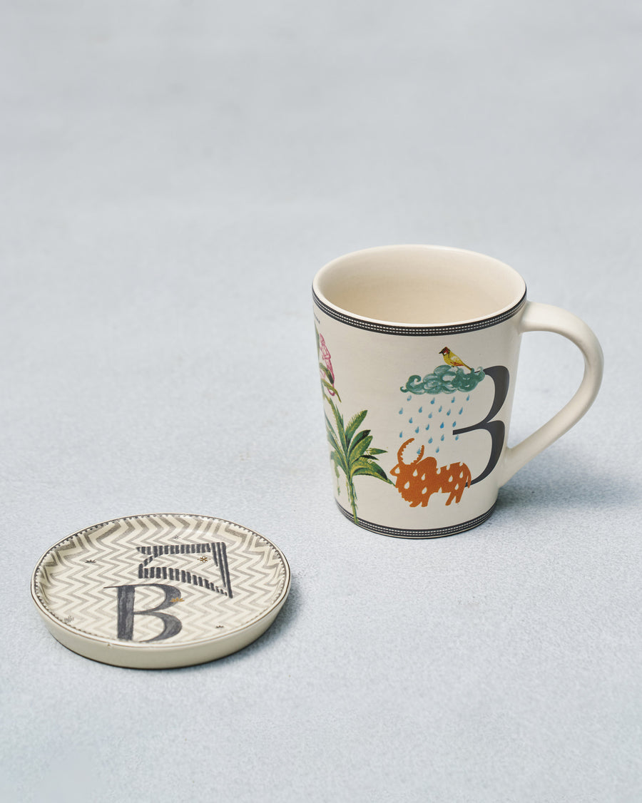The B mug beside its coaster