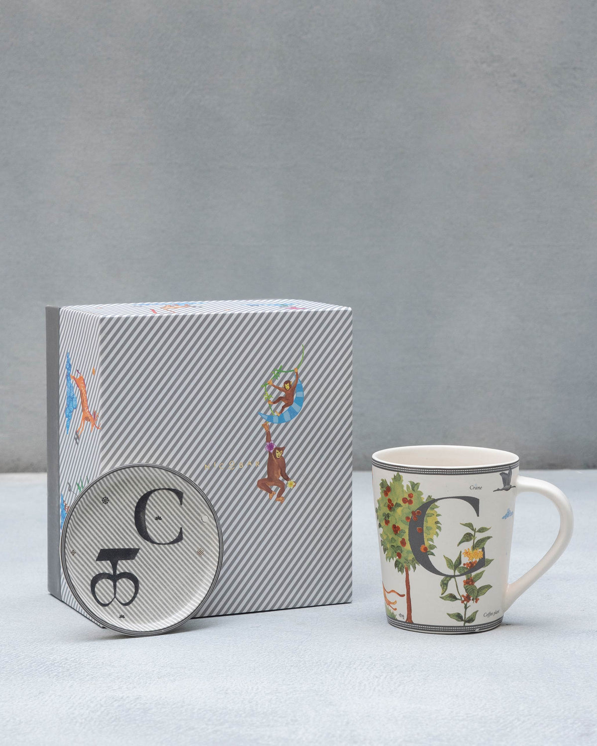 C Alphabet Set with a letter C mug, matching coaster, and Nicobar gift box.