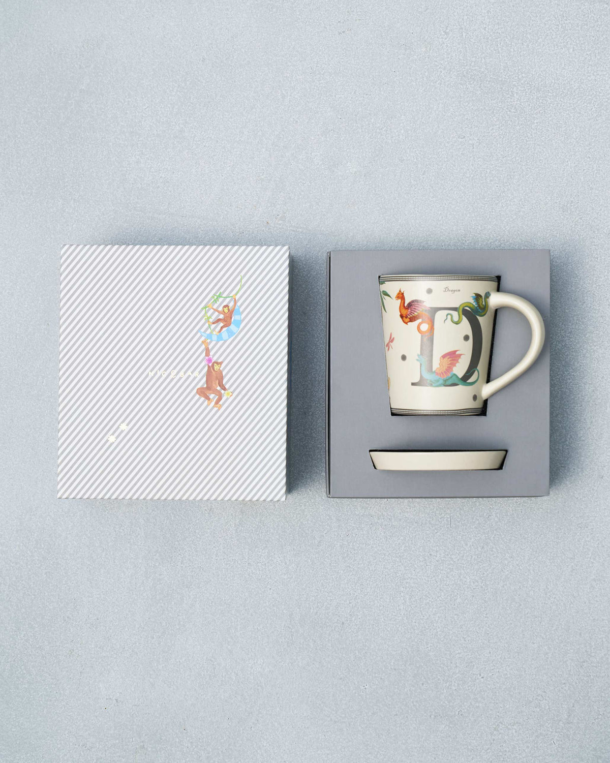 D Alphabet Set packed in its striped gift box with monkey lid.