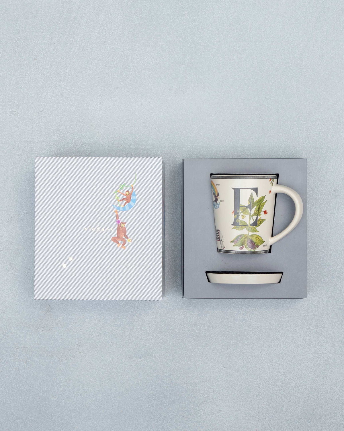 E Alphabet set packed in its gift box with mug, coaster and striped lid.