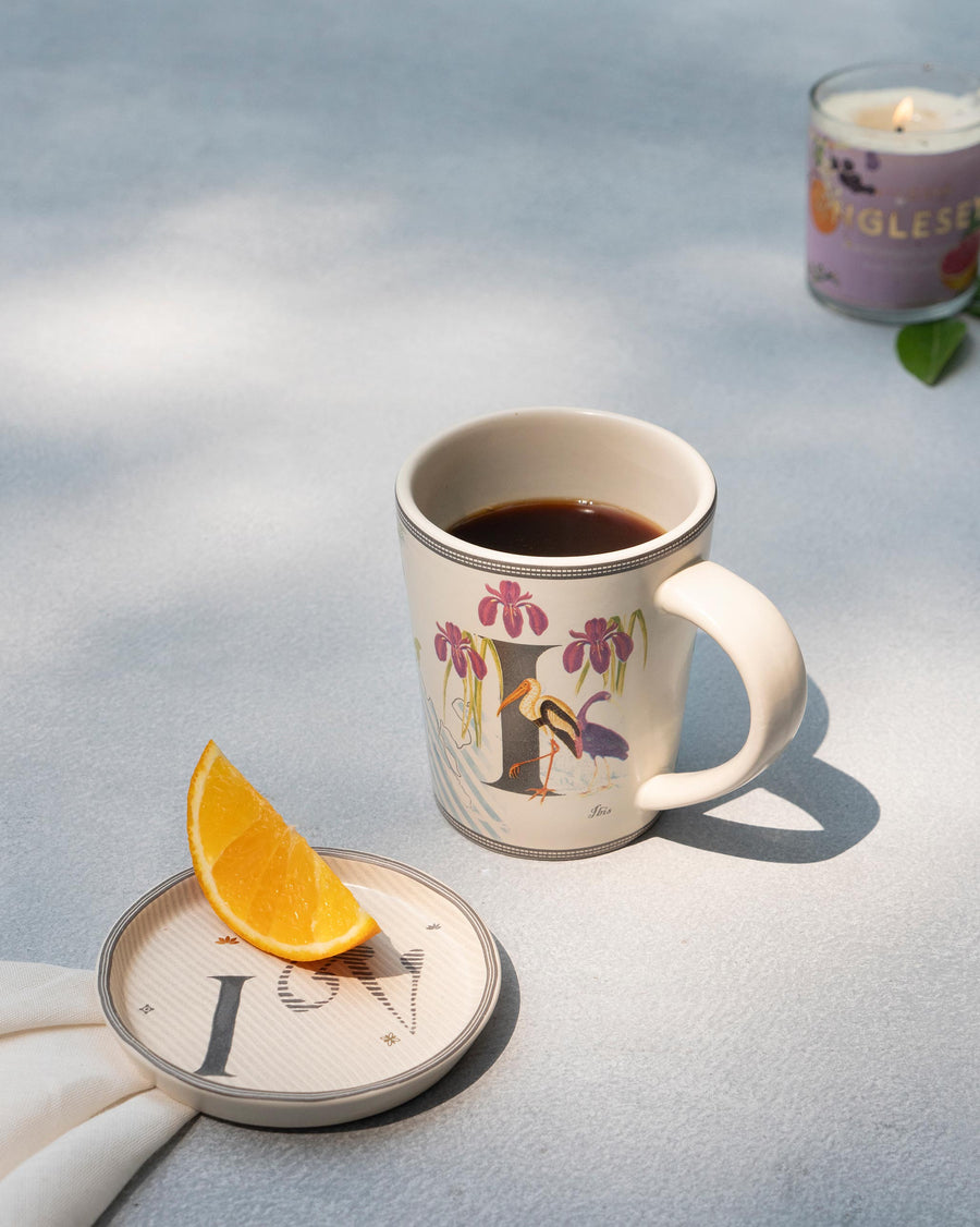 The I mug of coffee beside its matching I coaster
