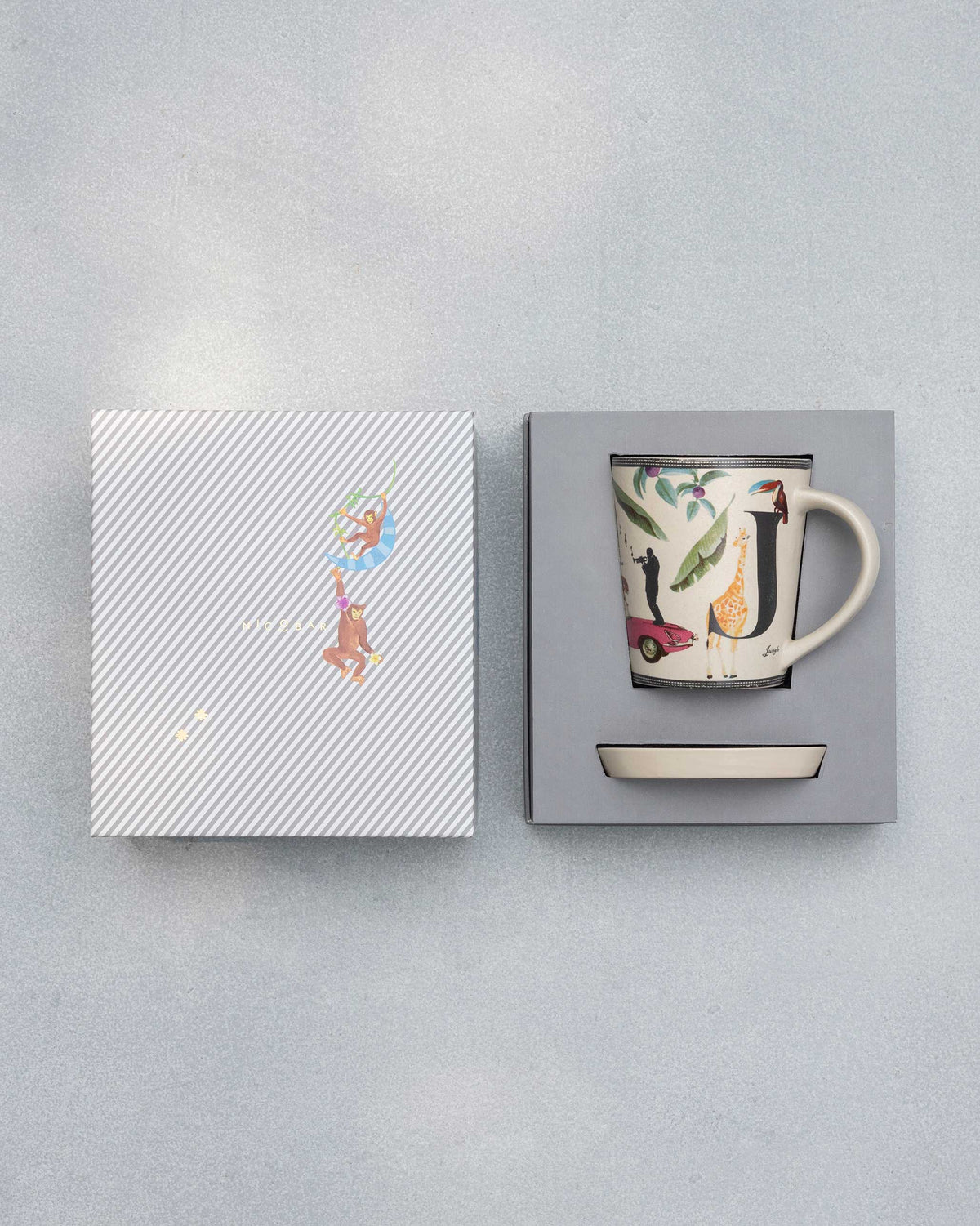 J Alphabet set packed in its gift box with mug, saucer and striped lid.