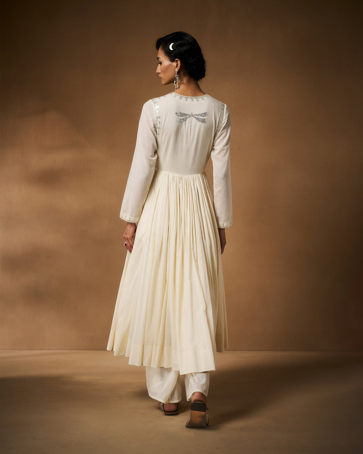 Back of an ivory Aafreen Angrakha with a silver dragonfly embroidery.