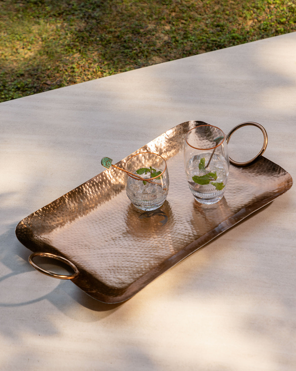 Serena highball glasses with copper rims served with ice and mint.