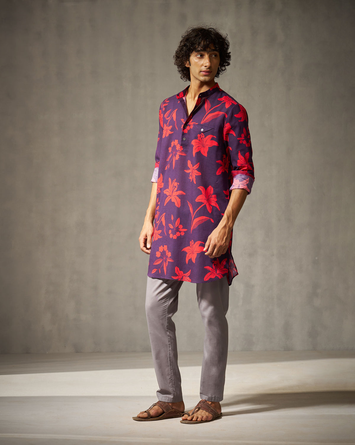 Person wearing a purple Fort Kurta with red florals and a chest pocket.