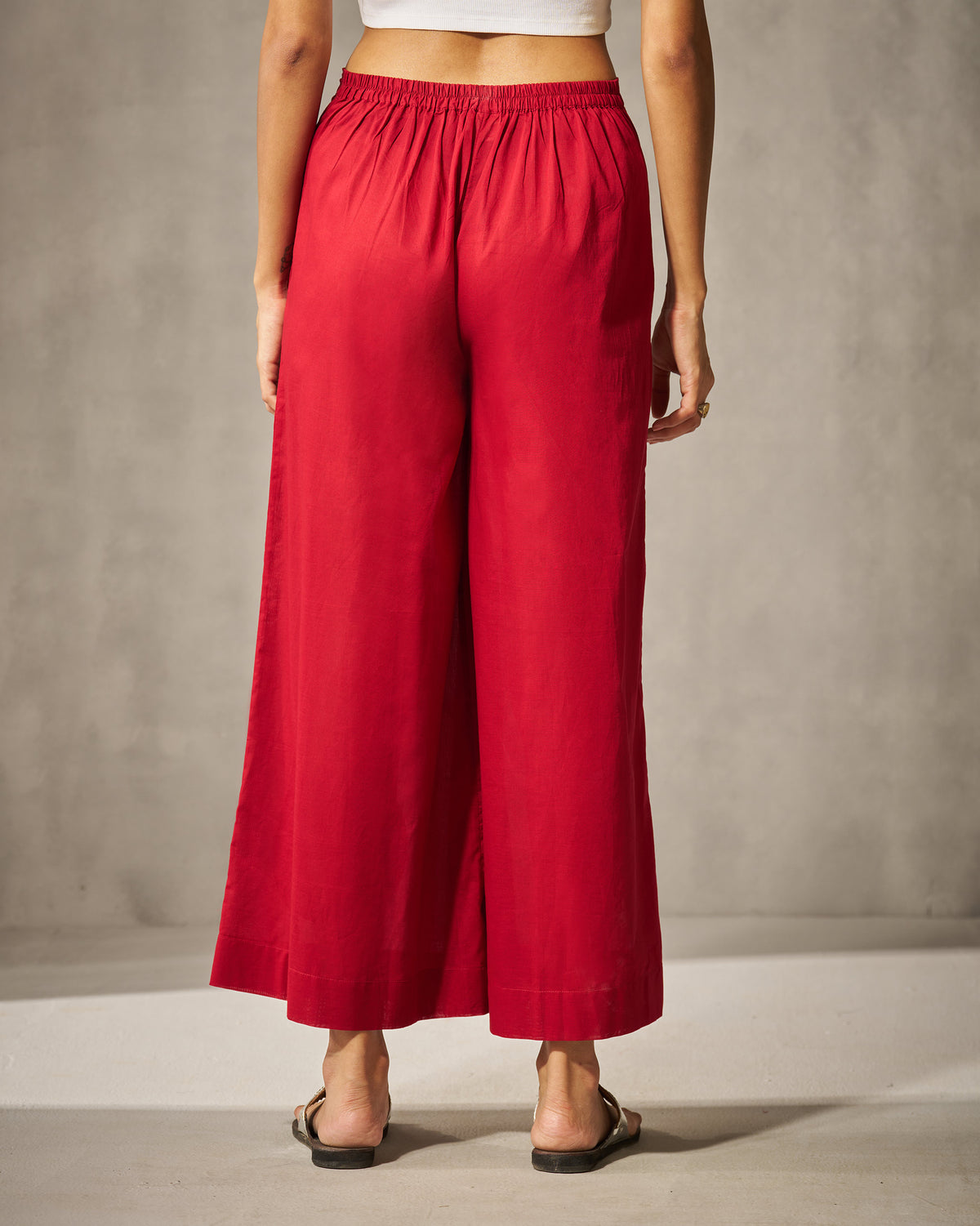 Back of red Basic pyjamas with a wide-leg silhouette.
