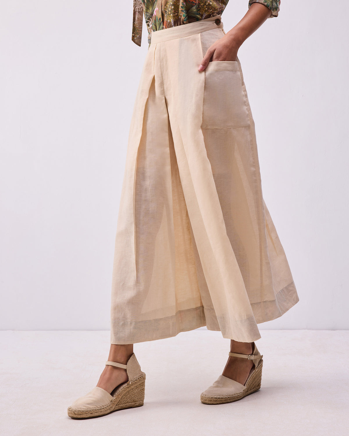 Person wearing a beige Pocket skort with a large patch pocket.