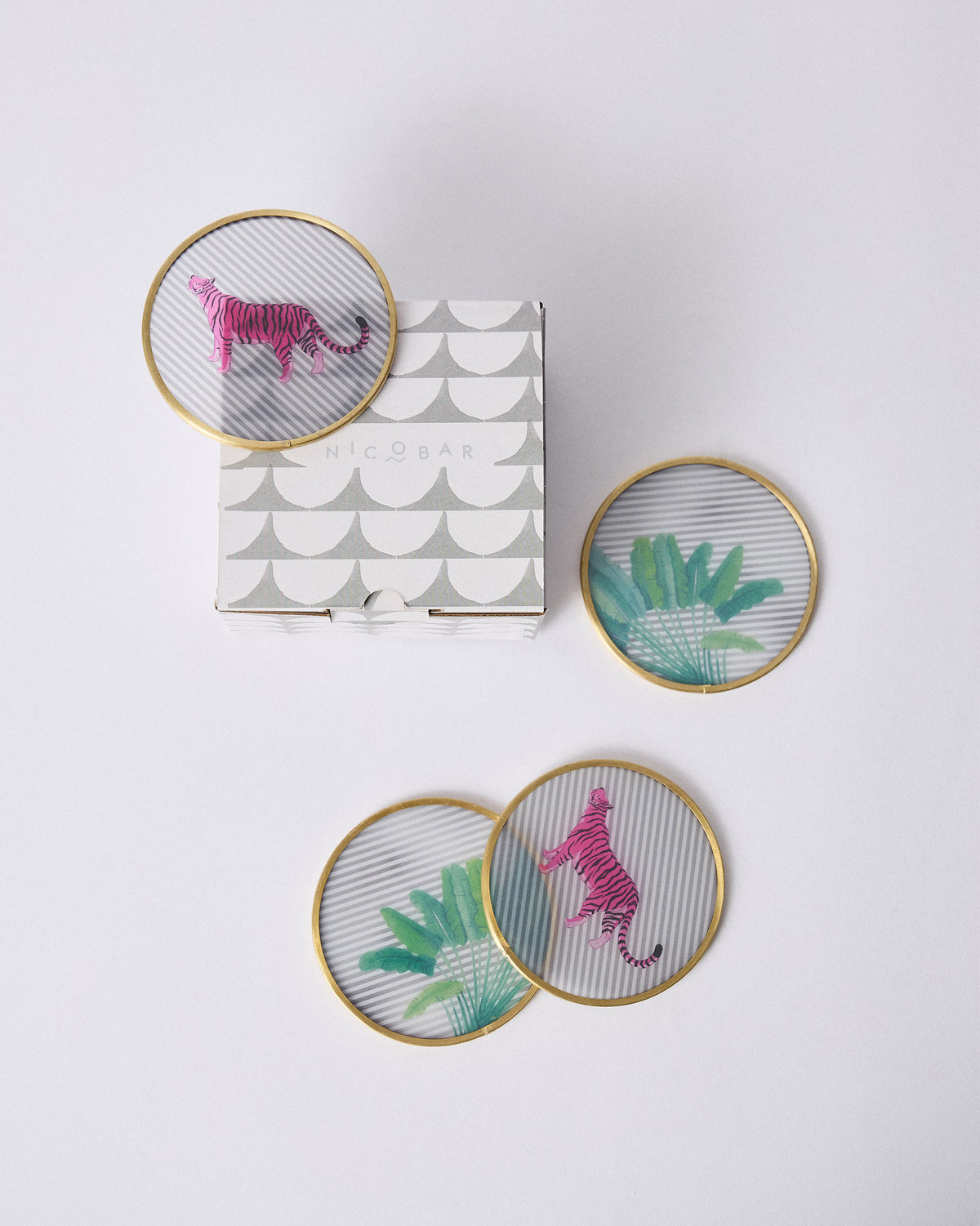 Ceylon Trail coasters with pink tigers beside their Nicobar gift box.