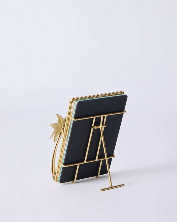 The back of the frame with its gold easel stand