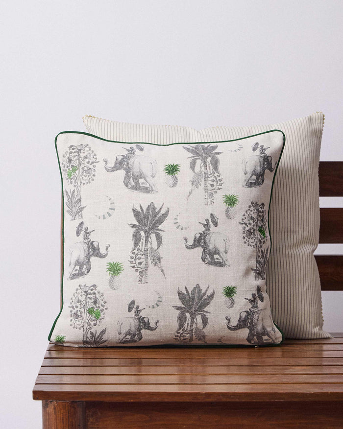 Ceylon Trail Cushion Cover with grey elephants, palm trees and green pineapples.