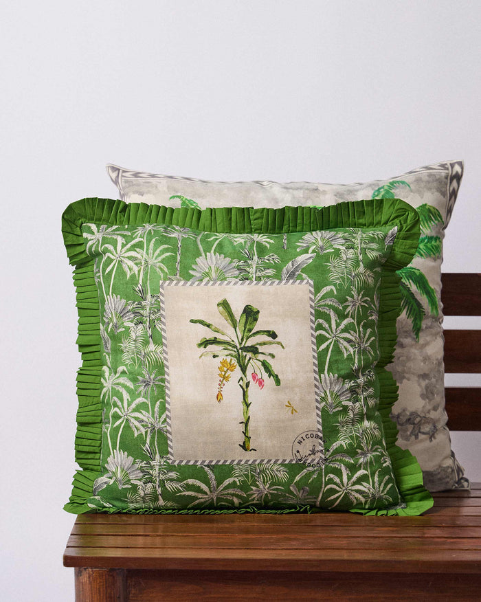 Palm Trail cushion cover with green palm print and a ruffled edge.