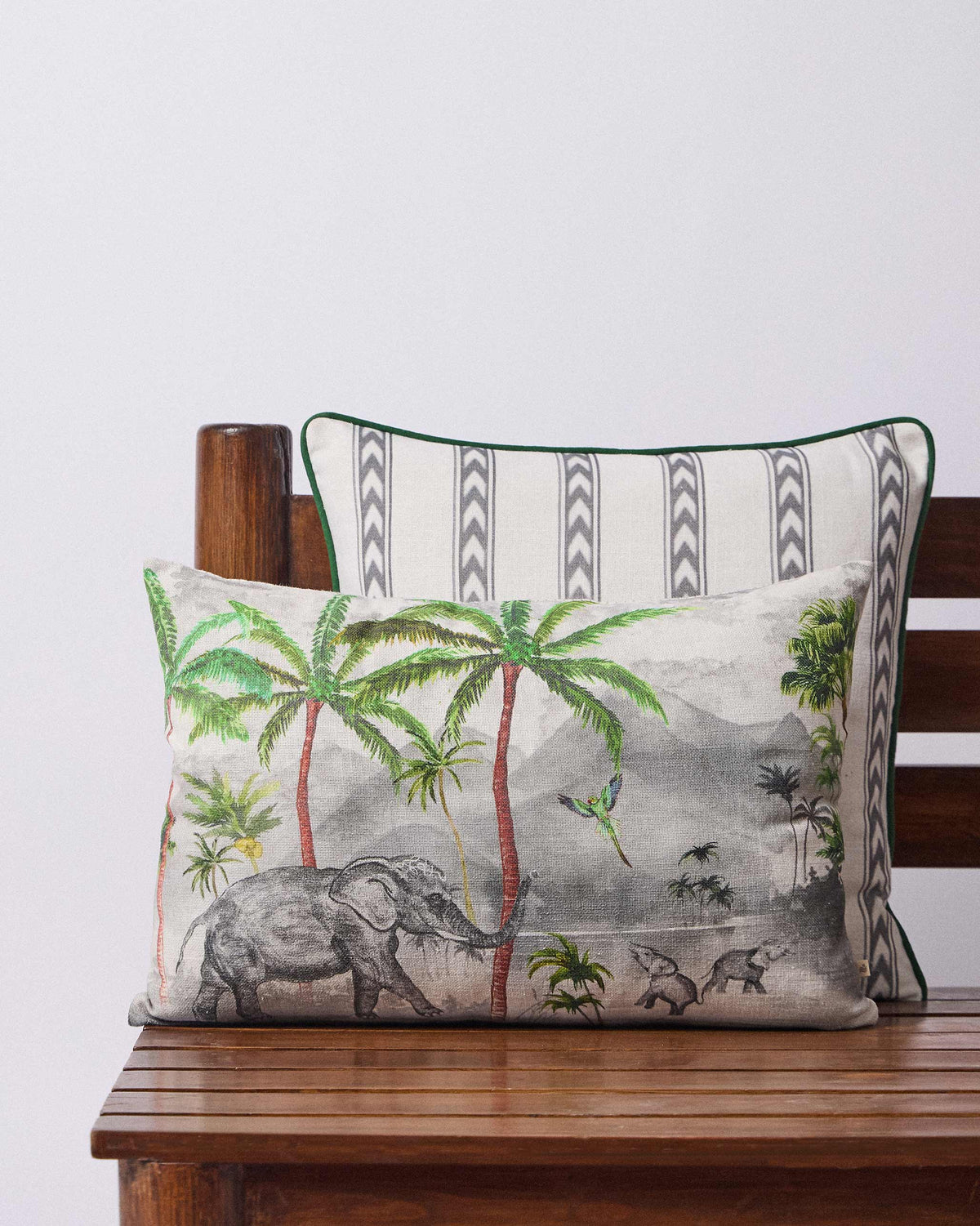 Ceylon Ele Lumbar Cushion Cover with palm trees and an elephant print.