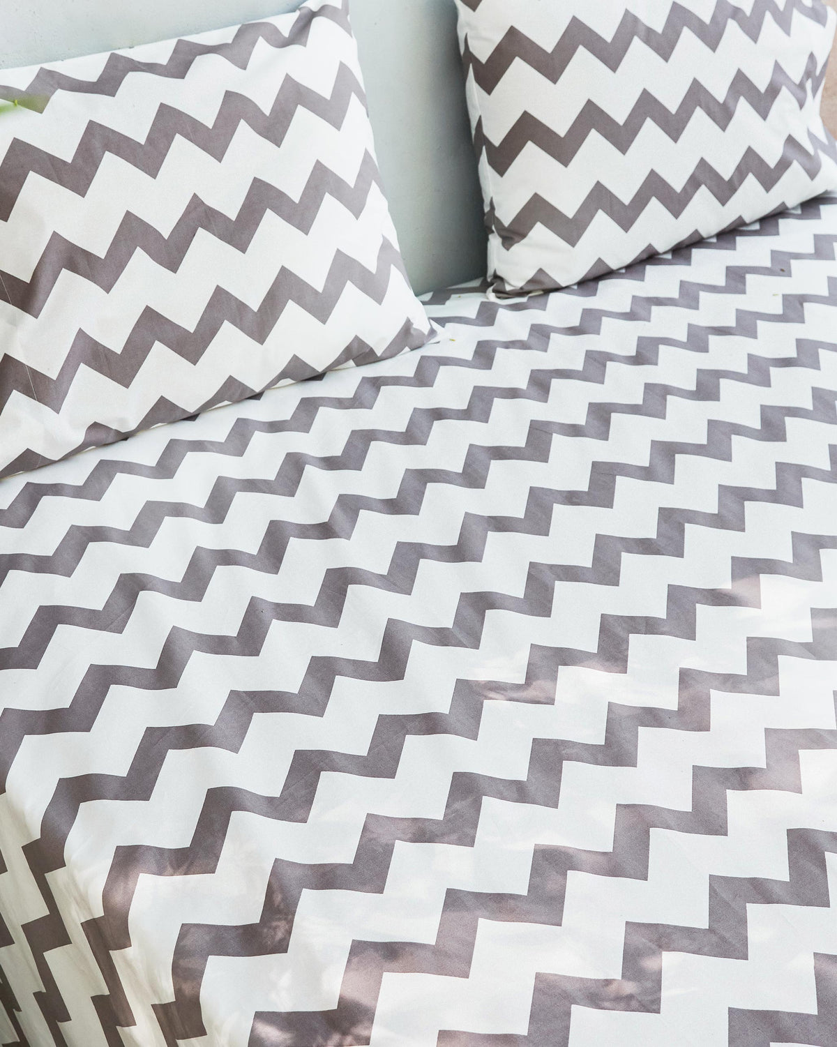 Close-up of a Colombo Wave bedsheet set showing the chevron pattern.