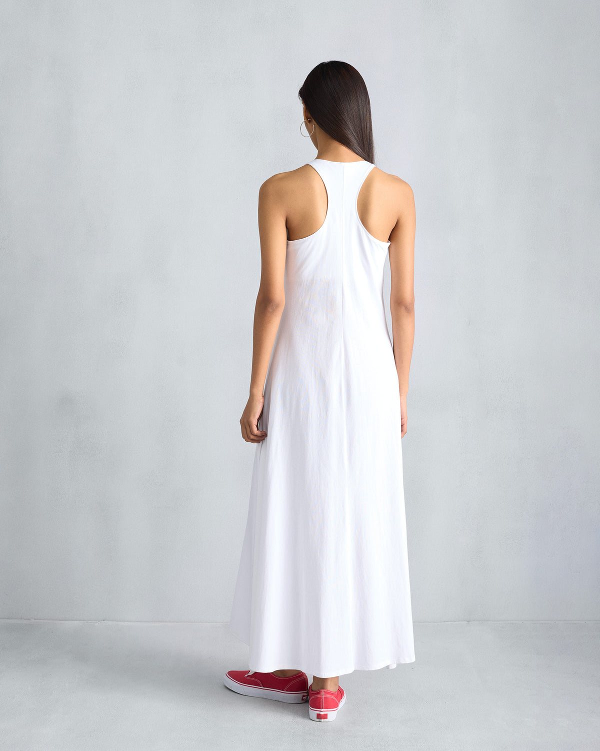 Back of a white Esther dress with a racerback and centre seam.