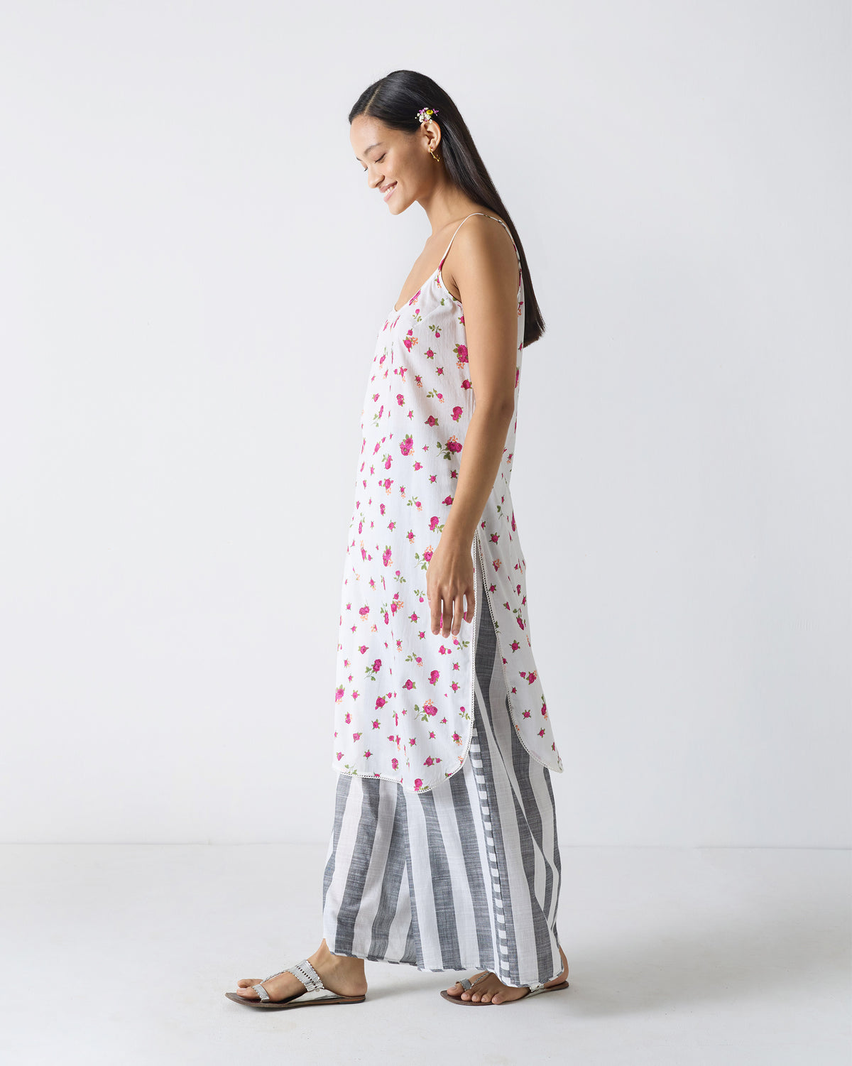 Side view of a white fuchsia-print Vintage Camisole with side slits.