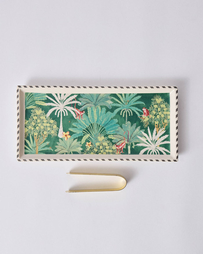 Ceylon Trail Cookie Tray with a brass tong beside it.