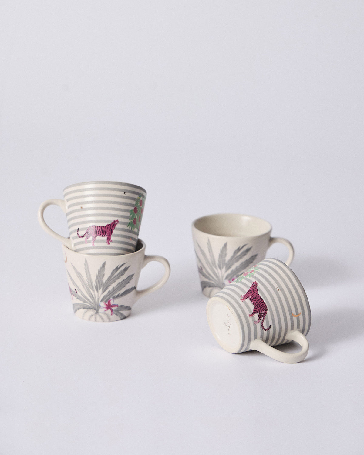 Ceylon Trail Espresso Mugs grouping pink tiger stripes and grey palm fronds.