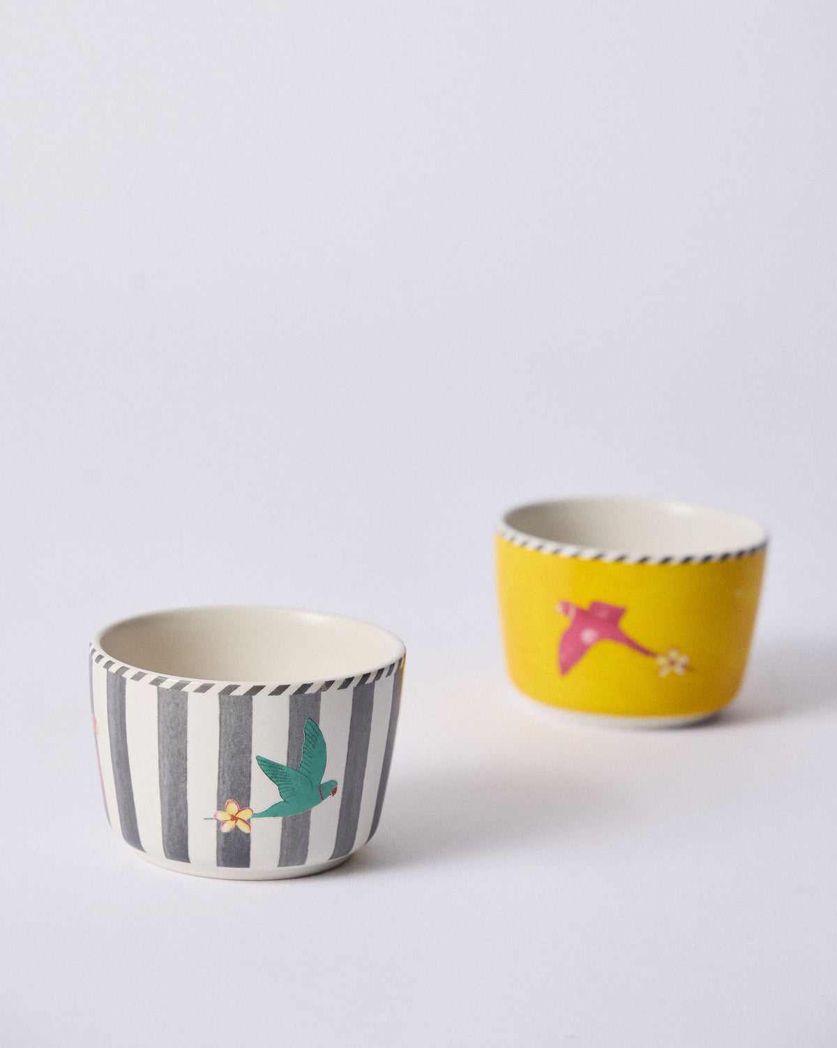 Ceylon Trail Nut Bowls showing striped teal and yellow magenta birds.