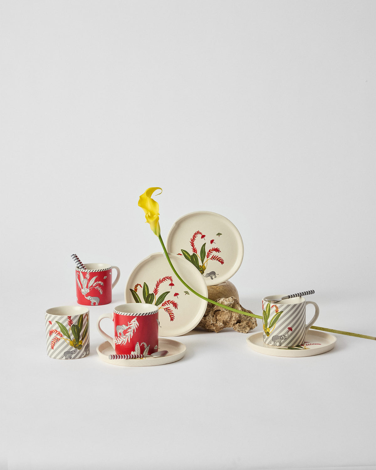 Thazin Trail Gift Set mugs and plates with red flower motifs.