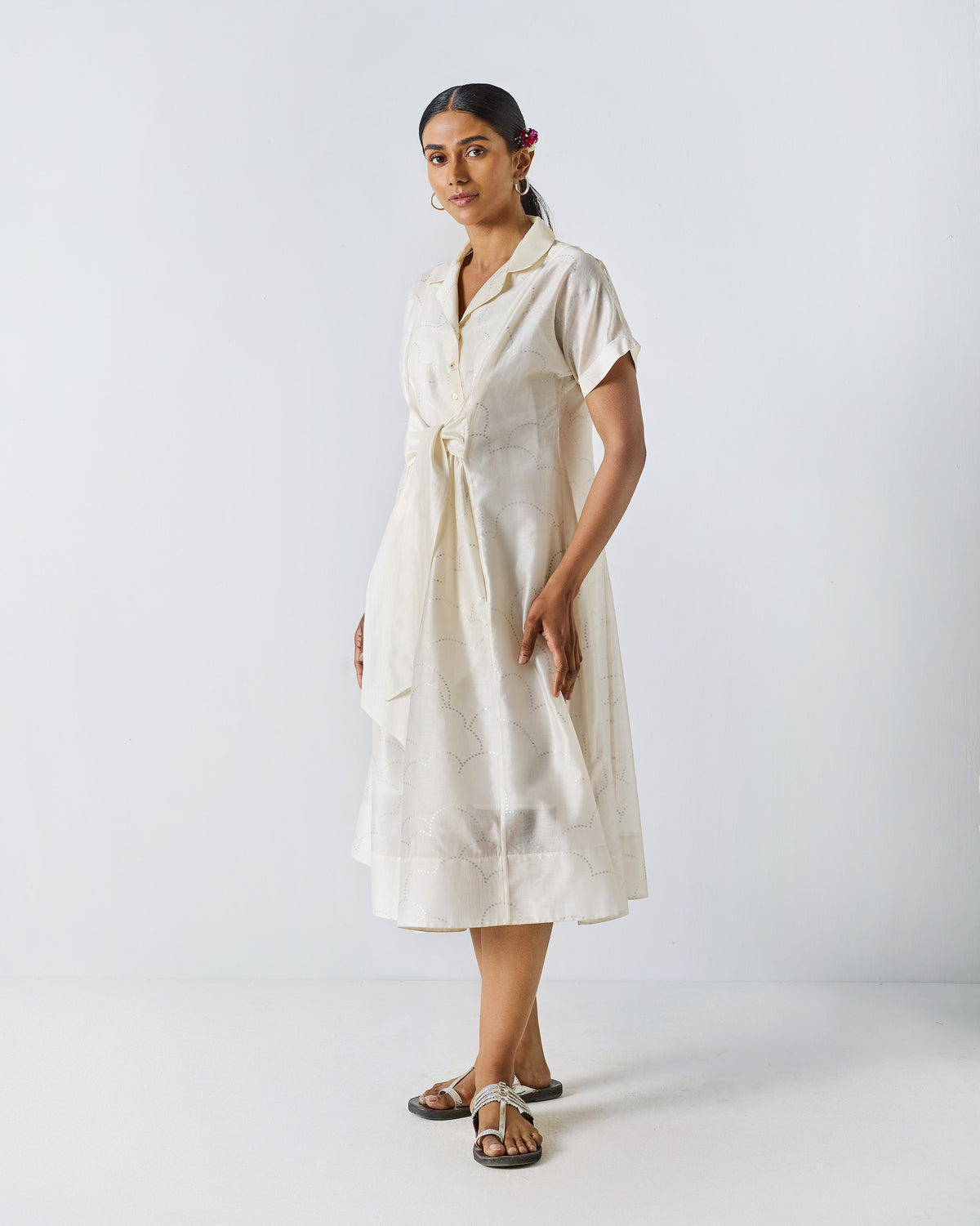 Ivory Cadeau Dress with a silver print worn at a three-quarter angle.